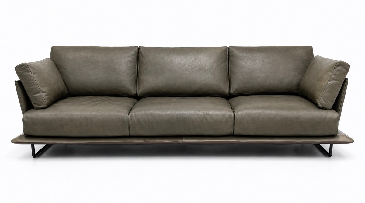 Dark three-seat sofa on a slim base
