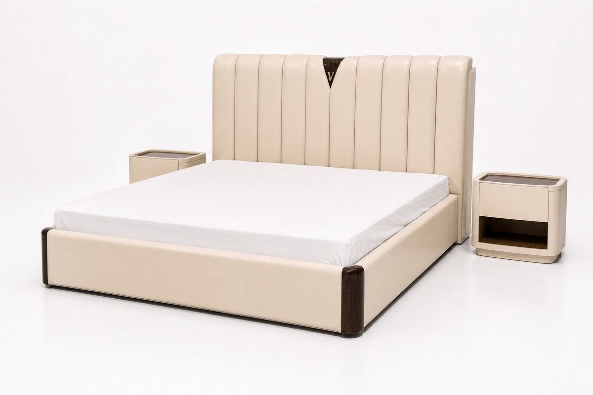 Cream channelled bed with prominent V crest; two bedside tables